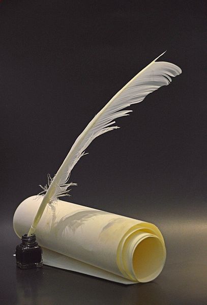 Quill pen, ink and parchment